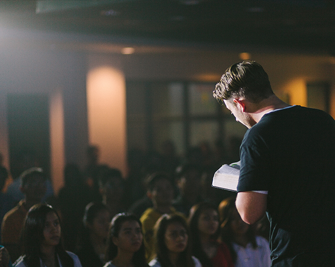 Pastor preaching to congregation