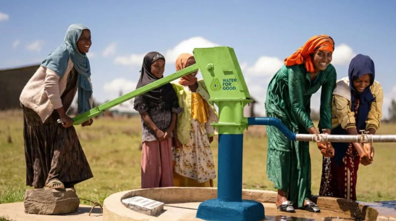 Women at the Water for Good Pump for clean water